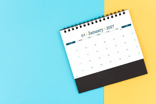 January 2027 desk calendar on blue and yellow, planning for business meeting or planning concept.