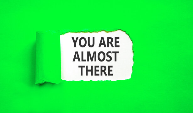 You are almost there words symbol. Concept words You are almost there on beautiful white paper. Beautiful green background. Business You are almost there motivational support concept. Copy space.