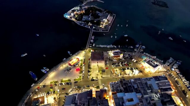 Nighttime aerial view of Porto Cesareo and Isola dei Conigli, Puglia, Italy