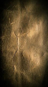gritty grunge gold texture background with vignette and aged appearance