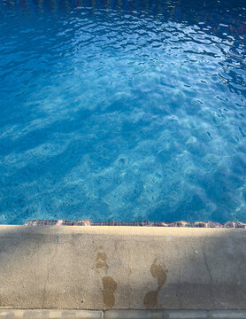 Water in a pool with sunlight reflecting on the surface