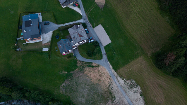 Aerial view of rural road, road junction in a mountain village