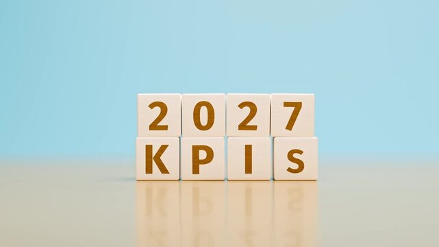 Wooden toy cubes forming the text "2027 KPIs". Concept for Key Performance Indicators of the year 2027 of an organisation or company. Dolly Camera