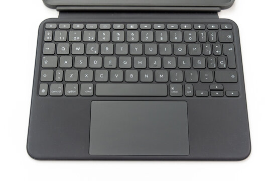 Top view of a black tablet keyboard case on white