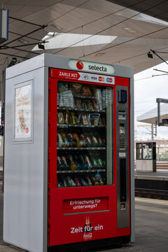 Vienna, Austria-July 10,2025. Photo shows a red vending machine full with goods at a railway platform