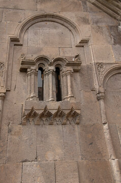 Distinctive tripartite window on the medieval stone wall of Goshavank Monastery in Armenia