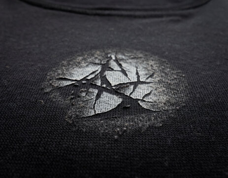 background featuring grunge ink splatters, rough scratches, halftone dots, and aged speckled patterns. This gritty retro design element creates a bold urban look, perfect for modern graphic design pro