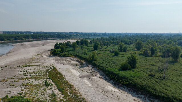 Aerial view of the Po river with exposed sandbanks and low water levels caused by a severe heatwave near Cremona, Lombardy, Italy.