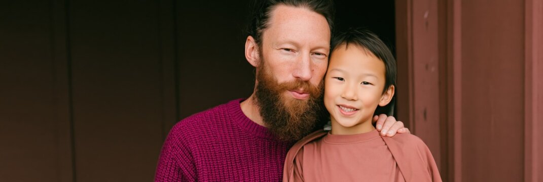Bearded father and son cozy portrait together for family banner and profile background with intimate mood