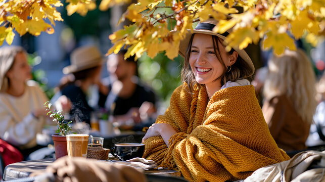 Cozy outdoor caf&eacute; terrace with warm blankets and steaming coffee as early autumn leaves begin falling around guests, inviting seasonal atmosphere, ultra photorealism, cinematic color correction, nat