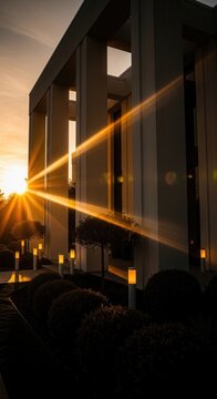 Modern Architecture Bathed In Golden Hour Sunlight With Dramatic Light Rays