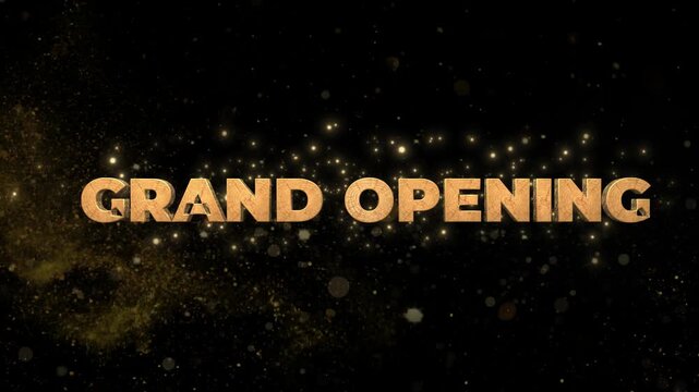 Grand opening text reveal animation featuring elegant gold particles floating against a deep black background with opening emerging swirling sparkling light particles