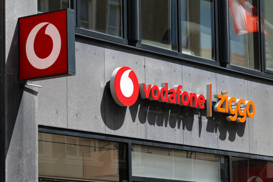 Vodafone and Ziggo Store Signage on Modern Building Facade