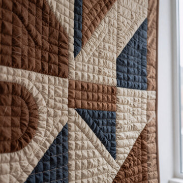 Mosaic Pattern Quilt. A Modern, Earth-Toned Quilted Wall Hanging With Abstract Pattern Features High-Resolution Detail Of Textured Stitch Work Under Natural Light