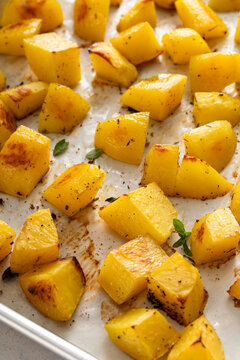 Oven roasted potatoes on a sheet pan cooked with garlic, herbs and spices