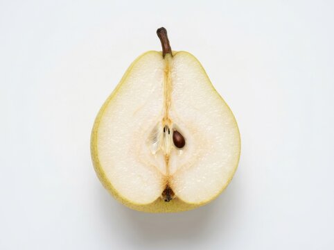 A fresh ripe pear cut in half isolated on white background