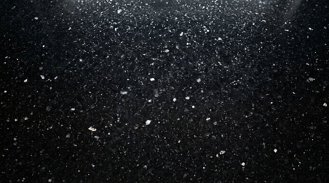 Abstract black granite texture background with sparkling white flecks with surface