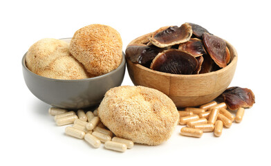 Different functional mushrooms and pills isolated on white © New Africa