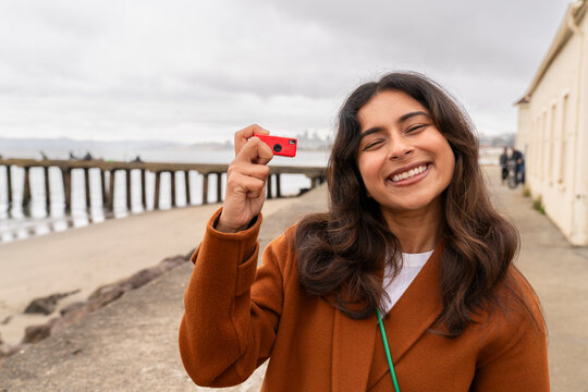 tourist with small keychain camera 