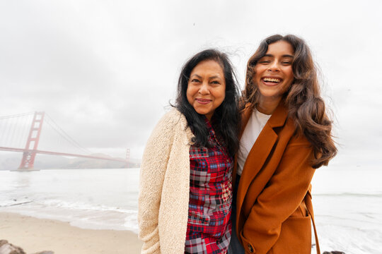 wide angle portrait two happy women Golden Gate Bridge mom daughter