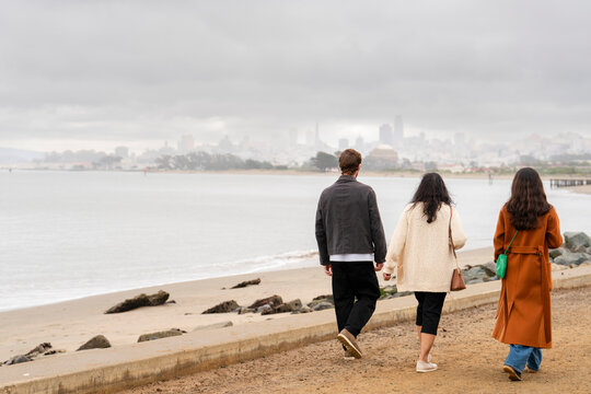 friends and family walking together san francisco bay area water