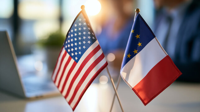 two national banners standing on a bright desk implying diplomatic talks and policy dialogue, negotiation and agreement concept, international relations, cooperation, formal