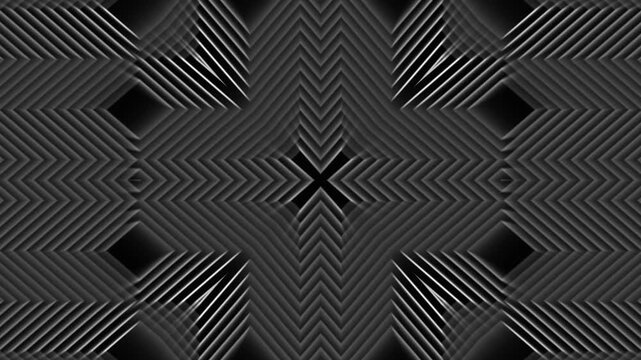 Abstract geometric patterns with evolving lines and shapes in a dark studio setting with subtle lighting