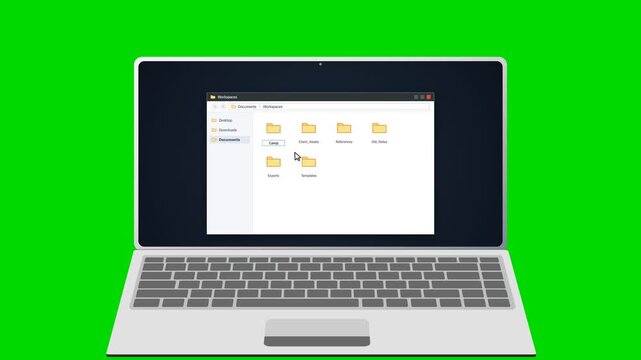 Laptop screen showing file explorer with folder being renamed on green screen. 4K Video