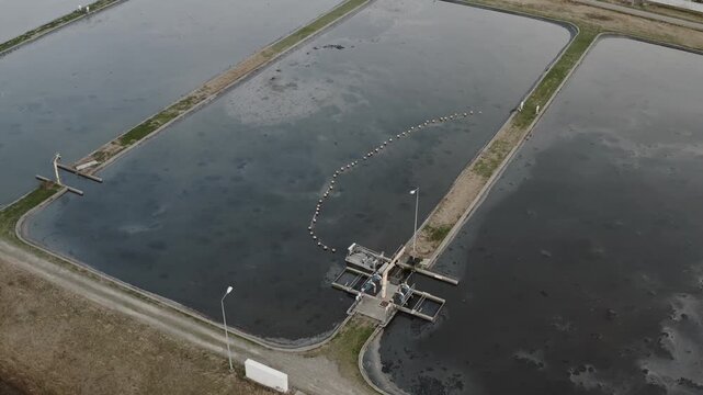 Water treatment infrastructure with wastewater basin, environmental engineering, purification, sewage management, aerial view.