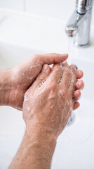 Fototapeta premium Close Up of Hands Washing Under Running Water