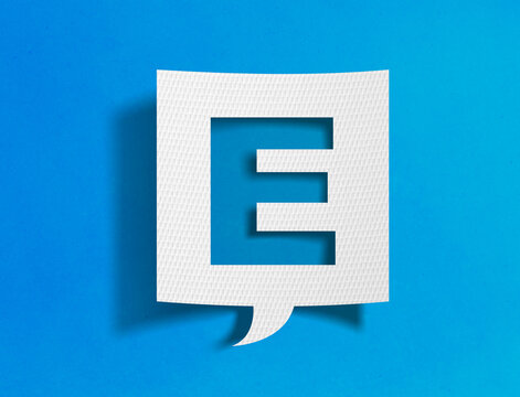 Letter E speech bubble on blue background with paper cutout design