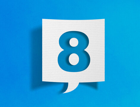 Number eight speech bubble on blue background with paper cutout design