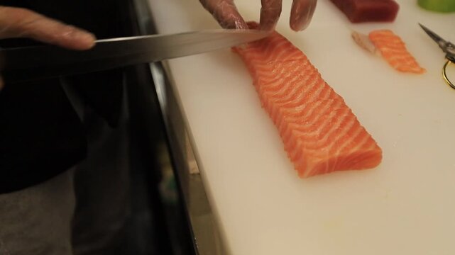 The chef prepares sushi dishes