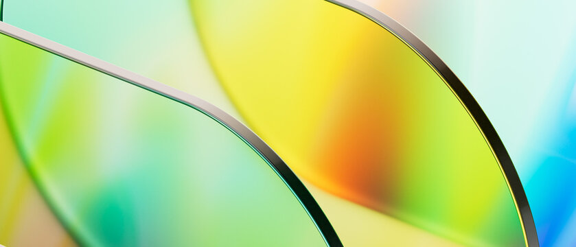 Artistic 3d rendering of translucent glass panels with vibrant rainbow holographic texture. Abstract macro composition for technology, media, and futuristic digital design project.