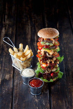Extra large hamburger with fries, mayonnaise and ketchup