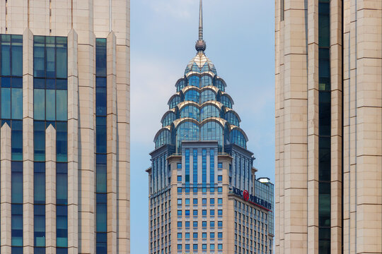 The Industrial and Commercial Bank of China (ICBC) skyscraper framed by two modern high rise facades, showcasing an urban business district atmosphere, Shanghai, China 31 July 2026