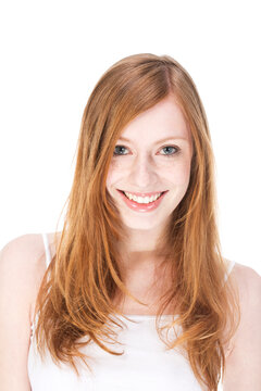 Portrait of young woman smiling, close up