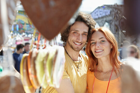 Happy young couple on a funfair