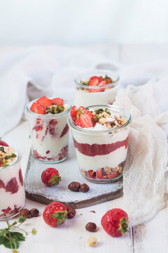 Greek yogurt with strawberries, strawberry-chia jam, hazelnuts and pistachios