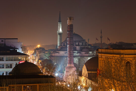 Turkey, Istanbul, Column of Constantine and Atik Ali Pasha Mosque at night