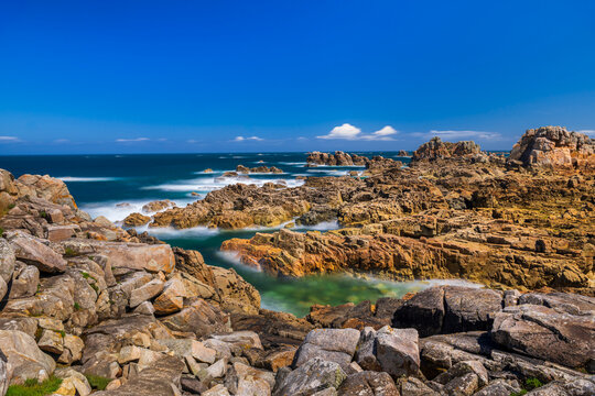Long exposure shows a rocky coastline in Brittany France