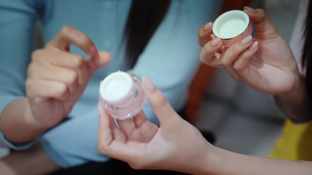 Skincare beauty face cream blogger influencer live streaming care tutorial - minimal light daily routine, clean glow - pink glass jar demo moves between hand - gentle application tips, safe calm mood