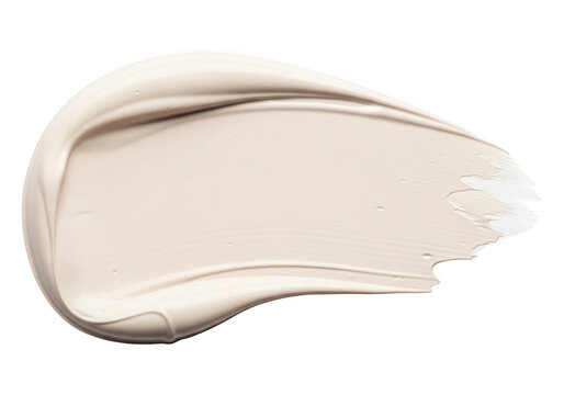 A thick, creamy smear of light beige cosmetic foundation or skincare lotion isolated on a solid black background, showing smooth texture and ridges