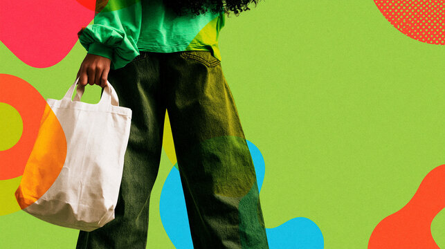 Person Holding Blank Canvas Tote Bag Against Colorful Background