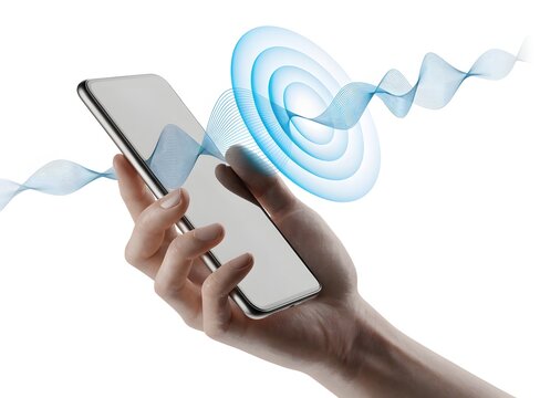 Hand holding modern smartphone with blue audio sound wave technology graphics. Mobile network connection and wireless data transfer. Person holding mobile device broadcasting sound frequency.