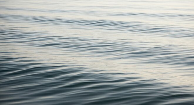 Calming abstract water surface with gentle ripples and soft light