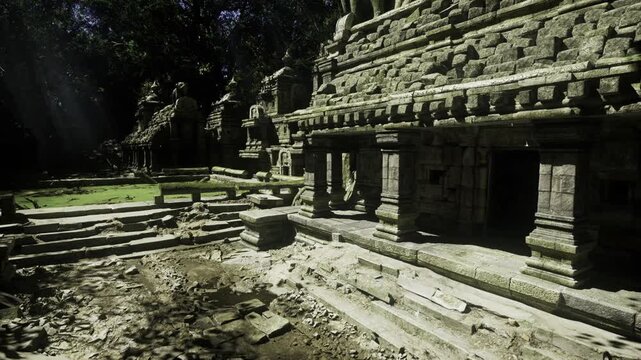 Ancient stone temple bathed in sunlight, dust motes drifting through carved colonnades, moss creeping over stepped courtyards, deep shadows between weathered