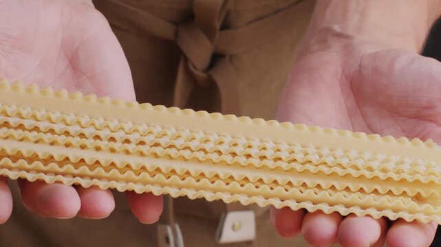 Italian tagliatelle pasta packaging window, Fettuccine pasta, close up, not cooked