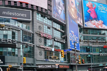 Fototapeta premium exterior of shoppiing center building with many advertisting signs and billboards