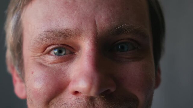 Smiling middle aged man 40 years old standing in office, portrait. Smiling blue eyes office worker, freelancer.
